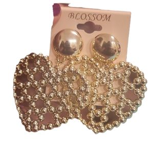 Blossom post back heart gold tone earrings. Little beads on the inside.